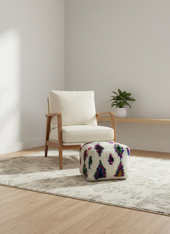 Colorful Moroccan Berber wool pouf in modern interior