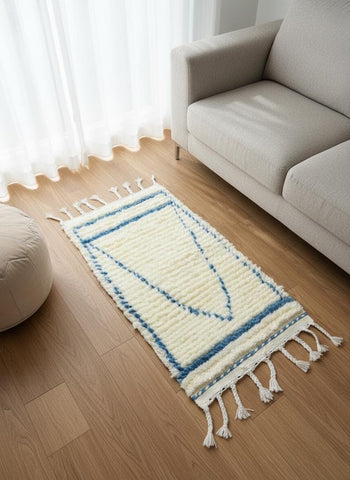 Blue geometric Moroccan rug placed beside sofa