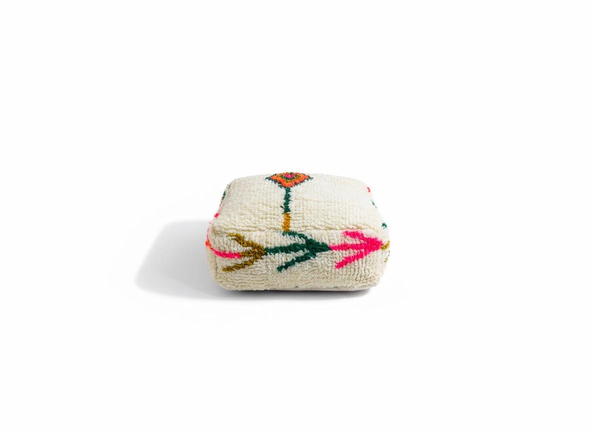 Handmade Moroccan wool pouf on white background
