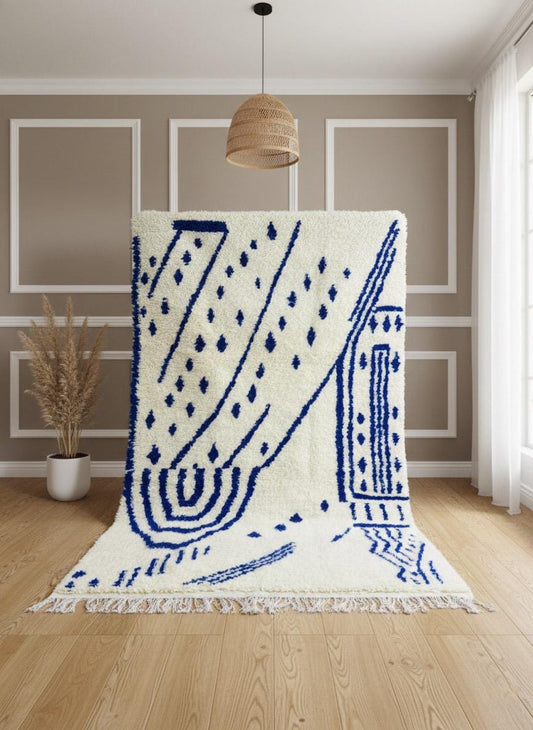 Blue and ivory Moroccan Berber rug styled flat