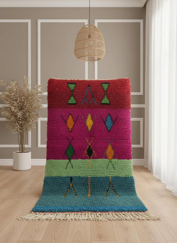 Bold geometric wool rug styled in modern bedroom interior.