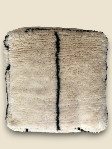 Beni Ourain style Moroccan floor cushion in cream with bold black stripe.