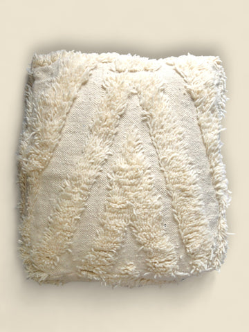 Cream Moroccan Berber pouffe with handwoven wool and textured chevron pattern,