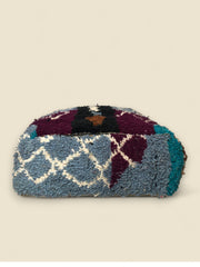 Blue and purple wool pouffe side with intricate Moroccan weaving