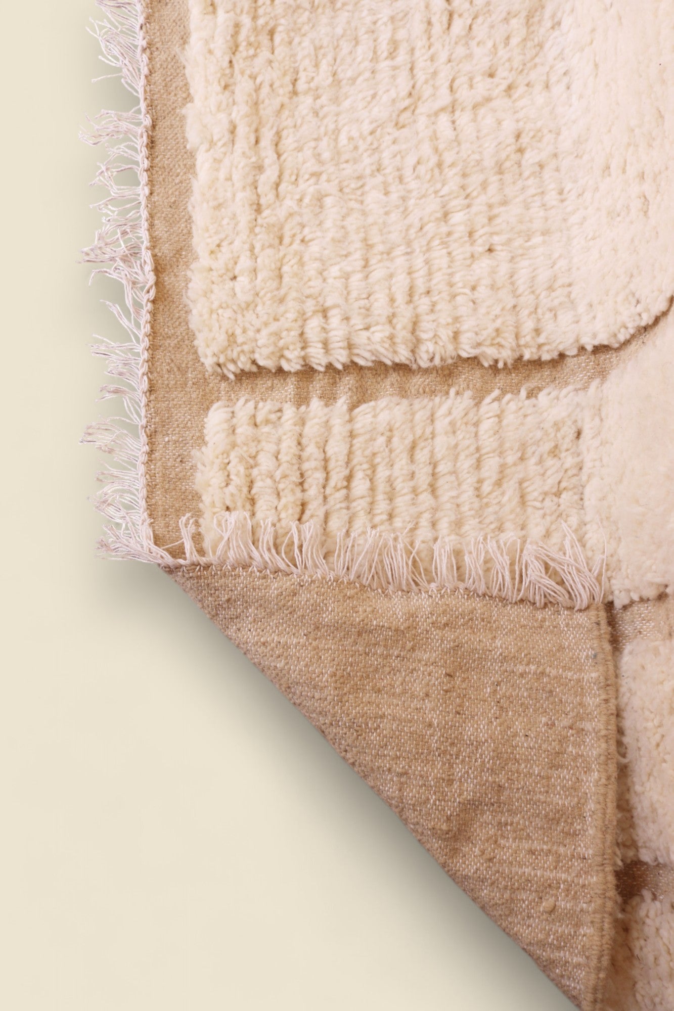  Underside view of the Ayla rug showing natural wool base and weave