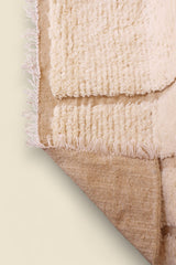  Underside view of the Ayla rug showing natural wool base and weave