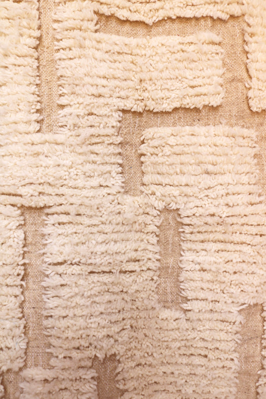 Detailed texture of high-low ivory wool pile on Ayla Moroccan rug