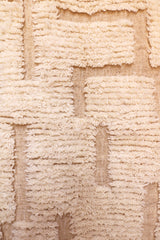 Detailed texture of high-low ivory wool pile on Ayla Moroccan rug