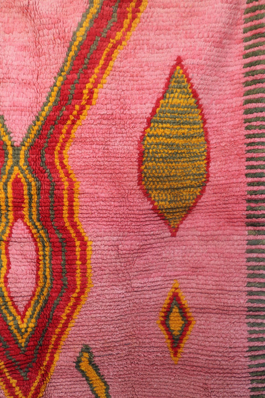 Right side detail of the Limra rug showing red and mustard lozenge shapes