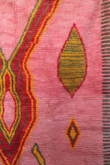 Right side detail of the Limra rug showing red and mustard lozenge shapes