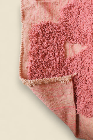 Rug corner flipped to reveal backside weave and craftsmanship