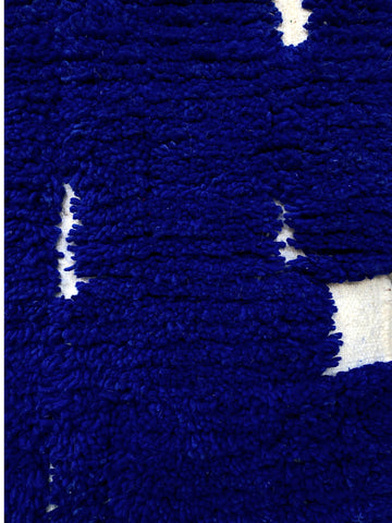Close-up of a blue textured surface with white patterns
