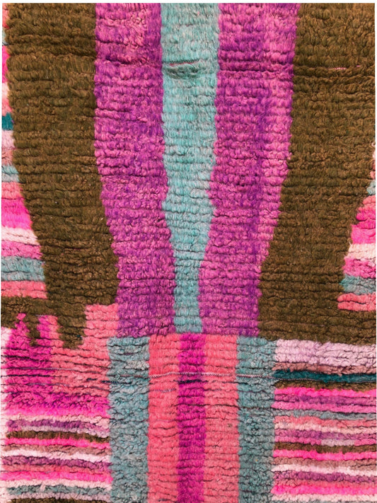 Center section of Tazult Rug with vertical abstract shapes in purple, aqua, and olive