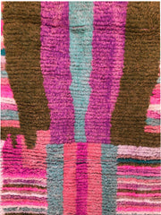 Center section of Tazult Rug with vertical abstract shapes in purple, aqua, and olive