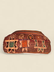 Back view of pouffe with green and orange geometric Berber symbols