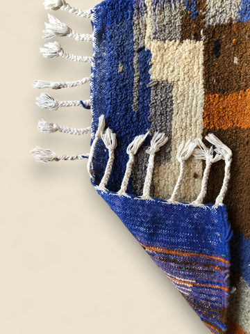 Backside of the Amayas rug showing handwoven texture and fringe craftsmanship