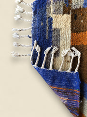 Backside of the Amayas rug showing handwoven texture and fringe craftsmanship