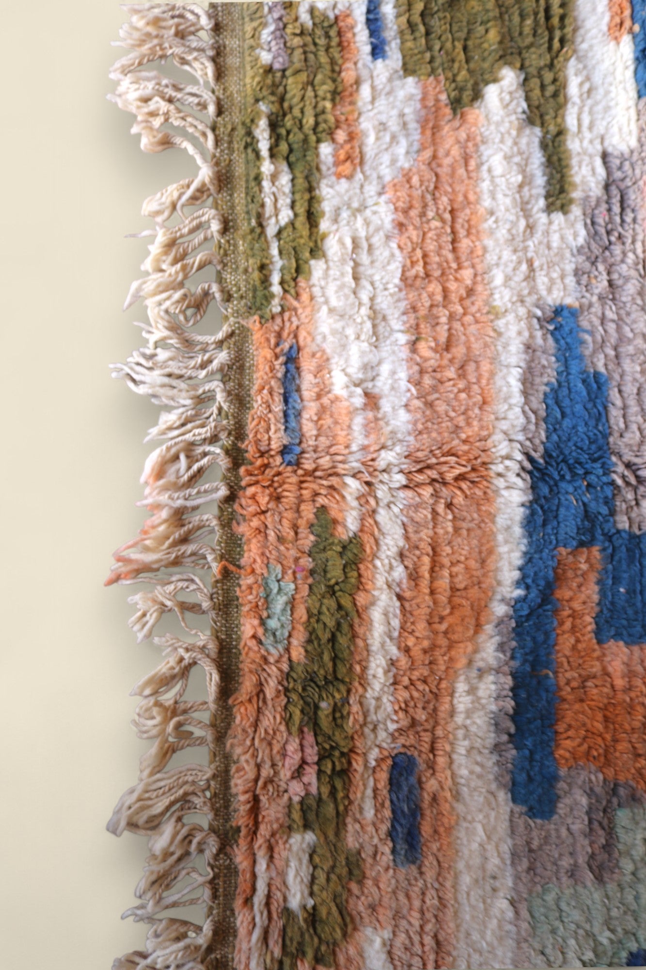 Fringed edge of the Temzine rug with visible wool knots and weft
