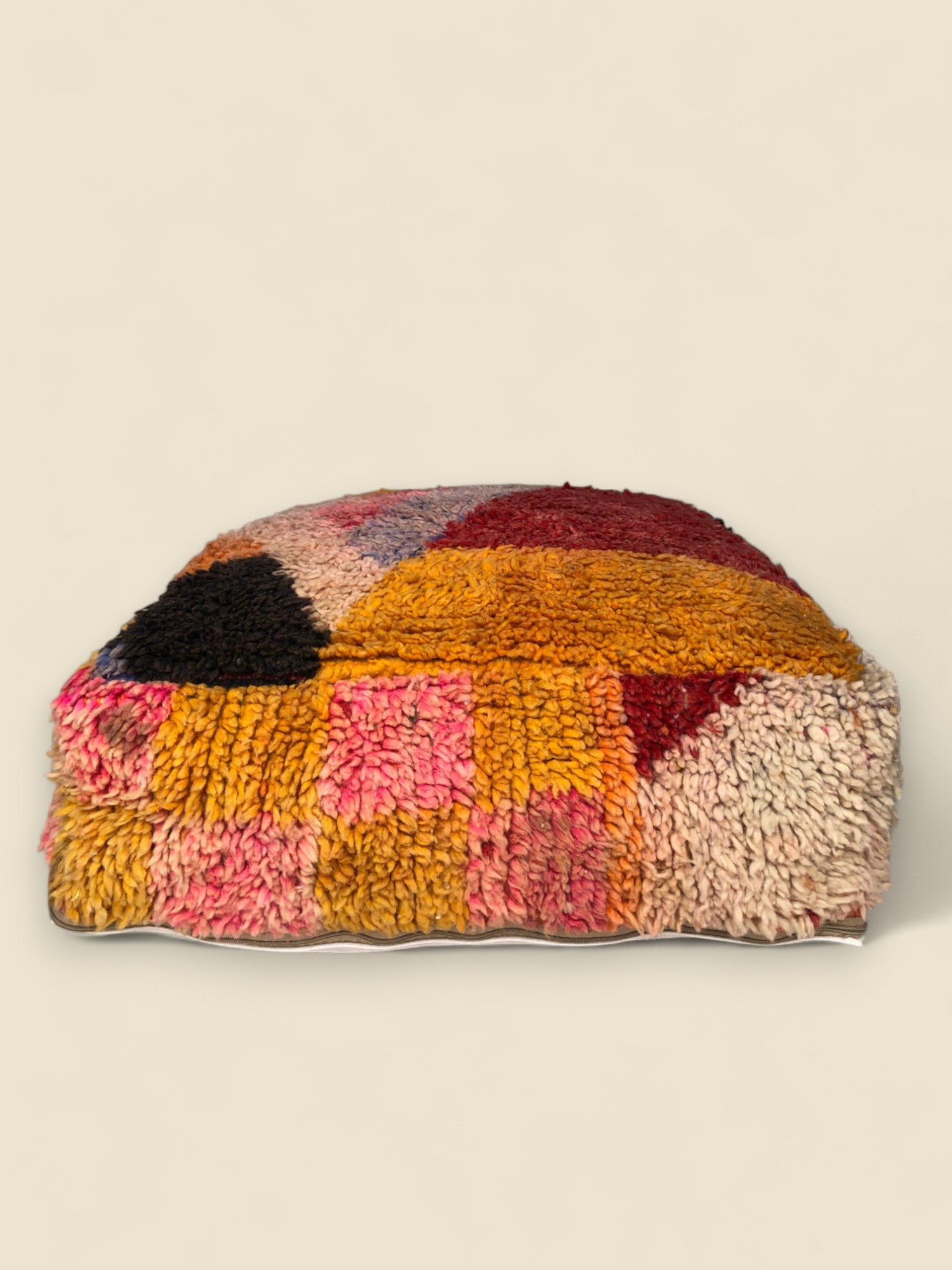 Handmade Tawenza pouffe in rich vintage wool with bold color blocks