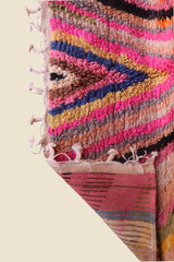 Corner of the Anir Berber rug showing colorful wool