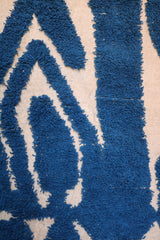 Central pattern with angular blue shapes in tribal geometric style