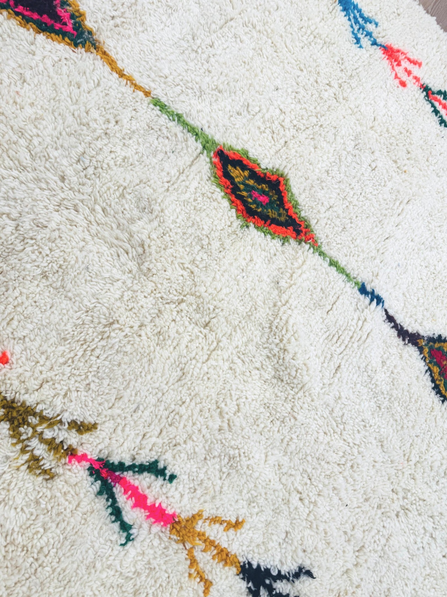 Close-up of colorful diamond motif on Tafouya Moroccan wool rug