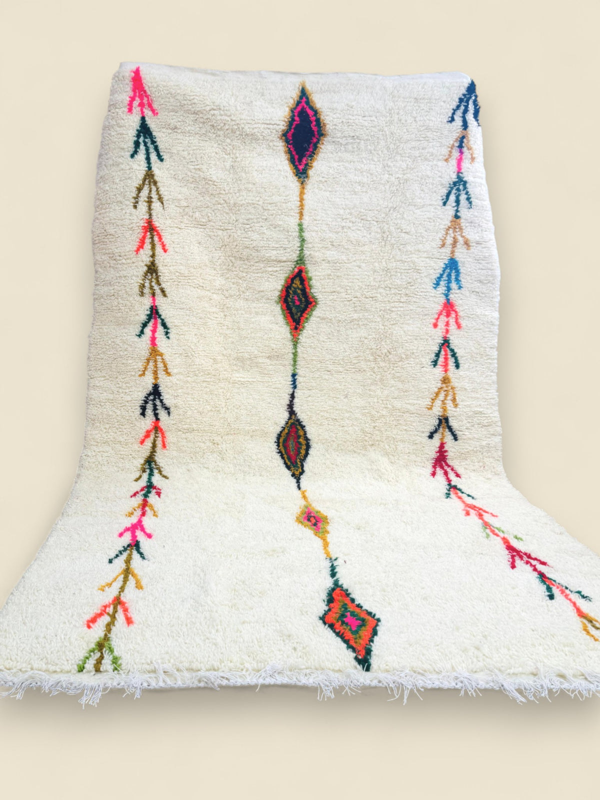 Handmade Tafouya Moroccan rug in cream wool with colorful tribal symbols