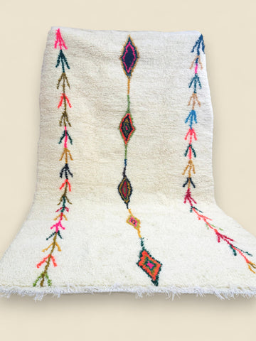 Handmade Tafouya Moroccan rug in cream wool with colorful tribal symbols