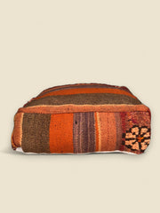 Vintage Tafraout Moroccan pouffe with burnt orange and tribal motifs