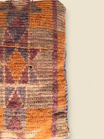 Vintage Moroccan Tazallit pouffe with geometric tribal designs