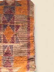 Vintage Moroccan Tazallit pouffe with geometric tribal designs