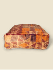 Side view of Tazallit Moroccan floor cushion with warm earthy palette
