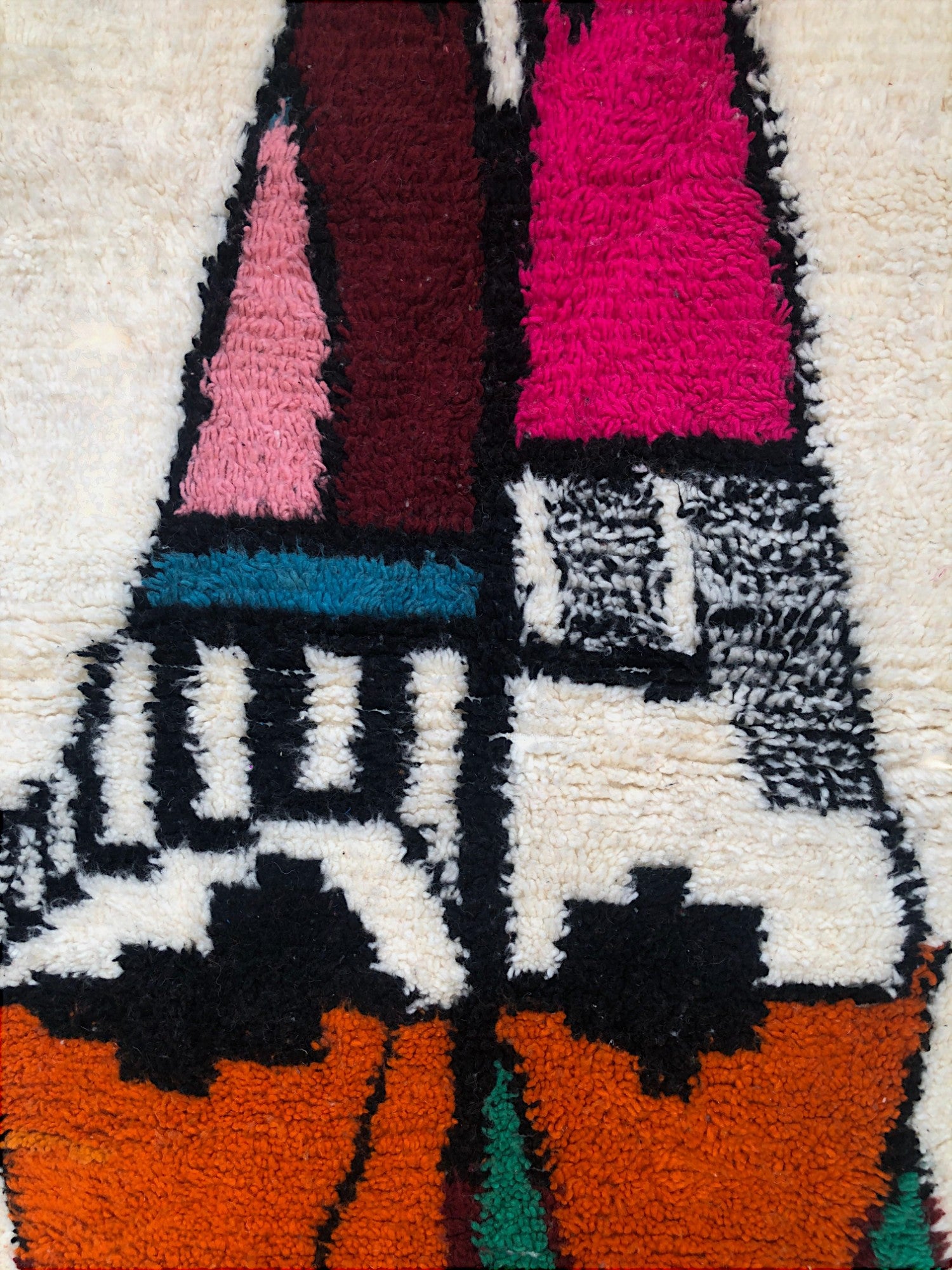 Abstract Tazghart Moroccan rug with bold tribal patterns in pink, orange, and green on ivory wool