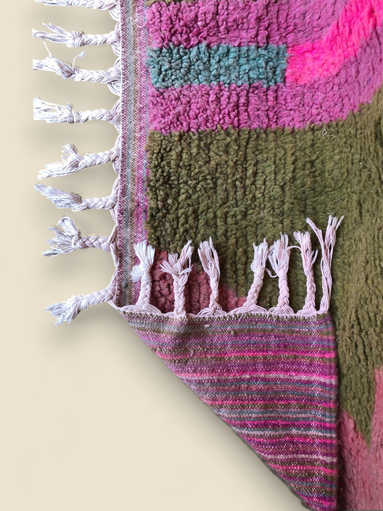 Corner fold of the Tazult Moroccan Rug revealing woven underside and fringe