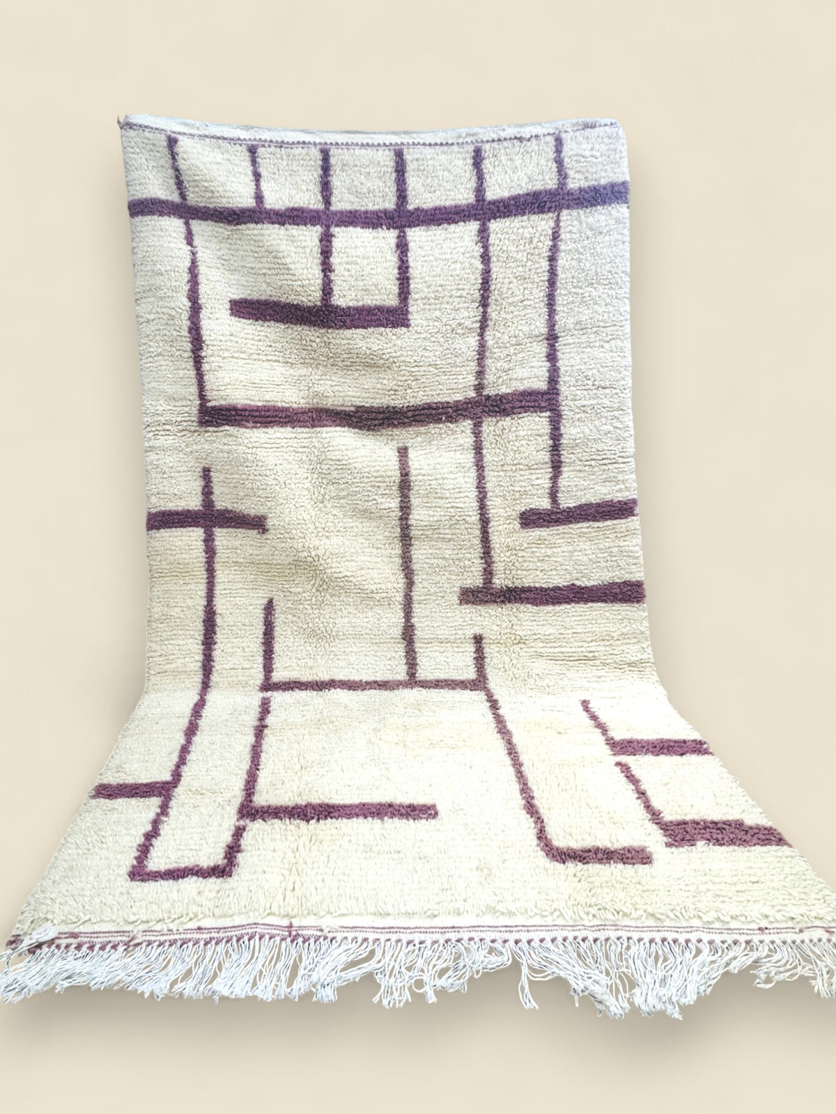 Handmade Tashelhit Berber Rug with mauve geometric lines on cream wool background