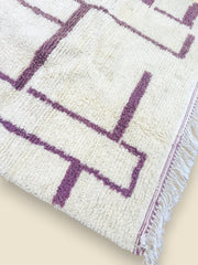 Detail of Tashelhit Berber rug showing thick wool texture and purple design