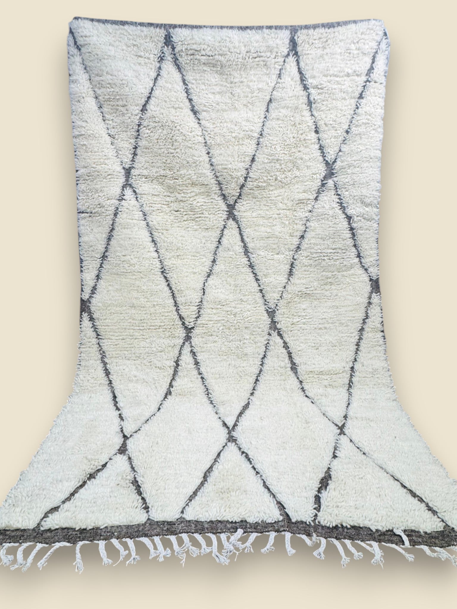 Tihya Moroccan Berber rug hung to show full diamond design