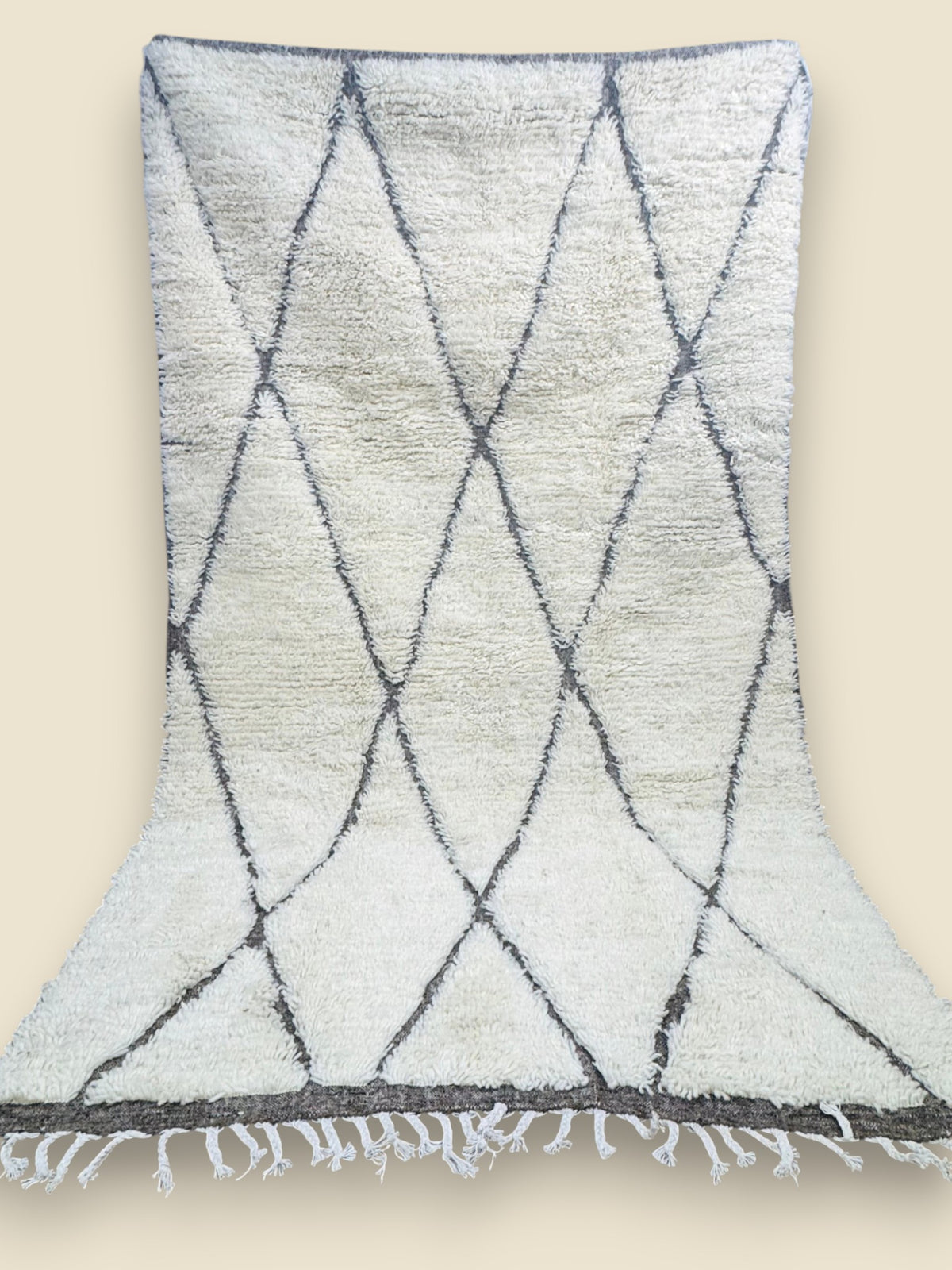 Tihya Moroccan Berber rug hung to show full diamond design