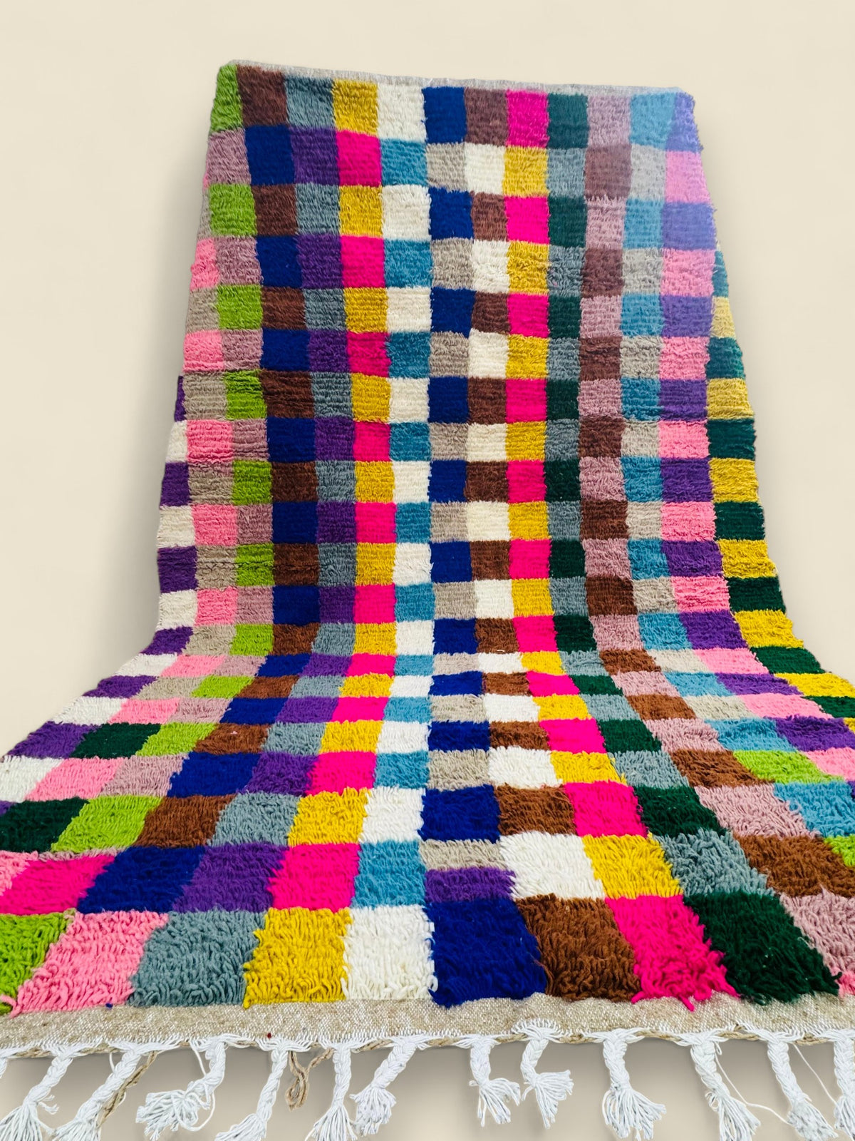Vibrant handmade Berber Tilawin rug with fringe details