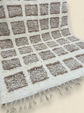 Folded Tilila Berber rug displaying backside weaving details