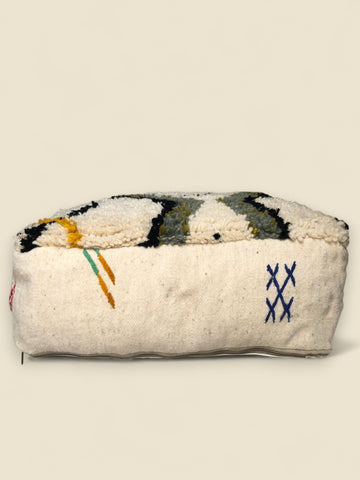  pouffe angle showing blue cross-stitching and yellow embroidered lines