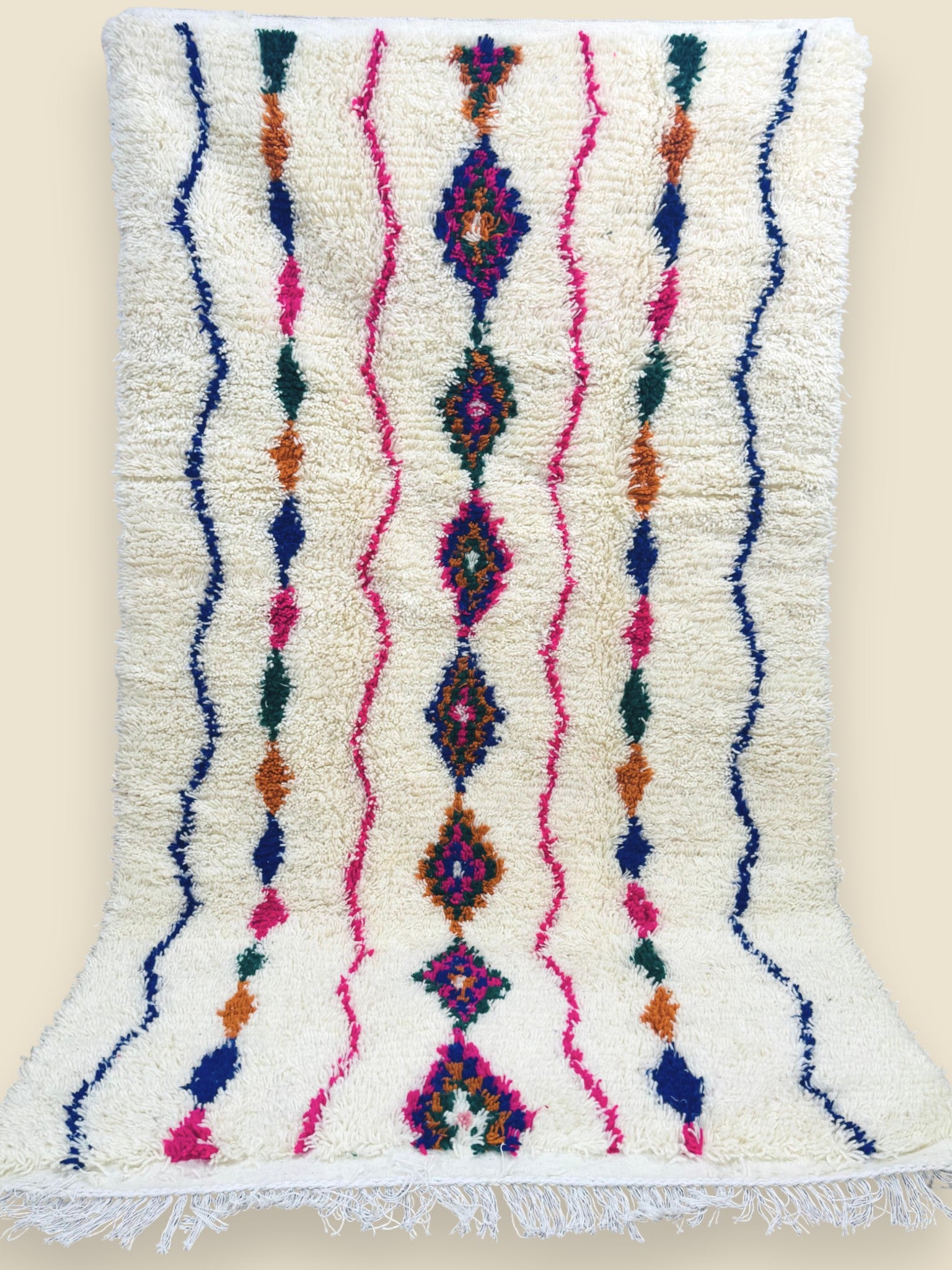Berber wool rug with pink, blue, and orange tribal motifs