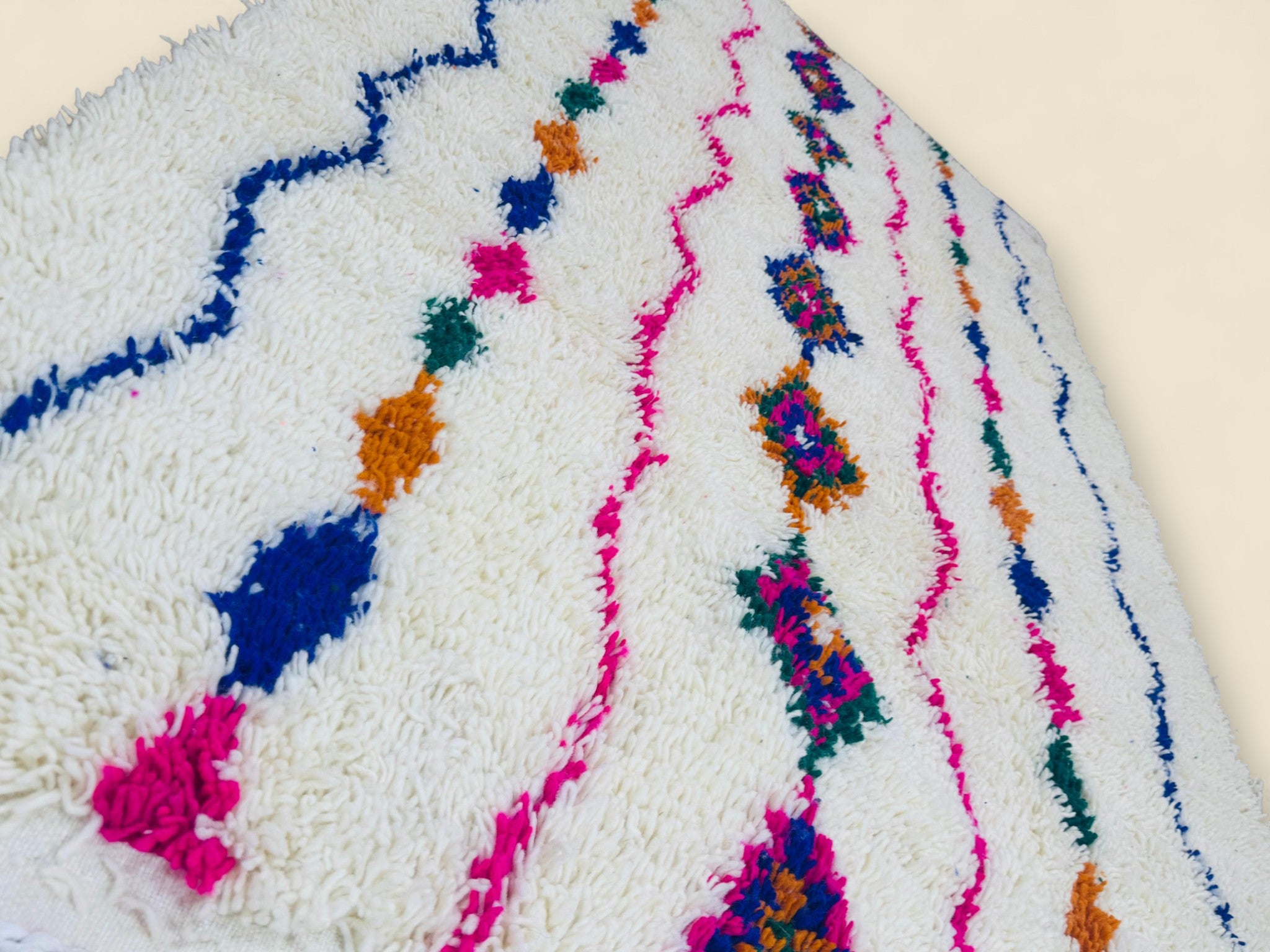 Close-up of colorful geometric details on Moroccan wool rug