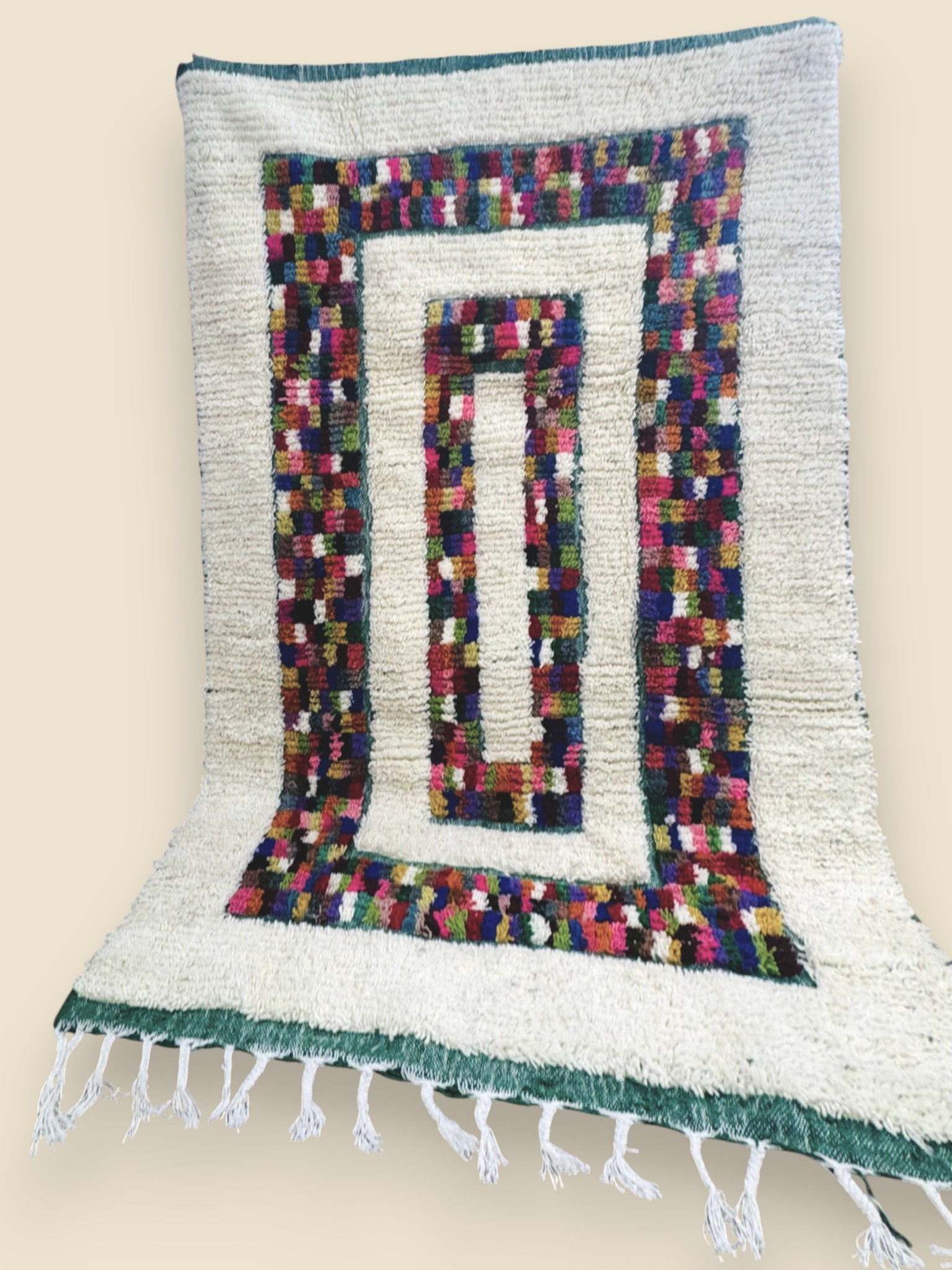 Handmade Berber carpet with vibrant rectangular motifs.