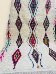 Close-up of Tura Berber carpet with vibrant geometric design