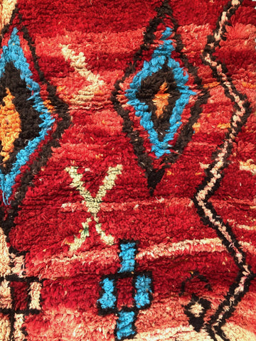 Close-up of a red patterned fabric with geometric designs