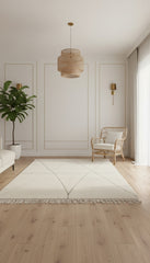 Cream Berber Awras rug with soft geometric design in a minimal living space.
