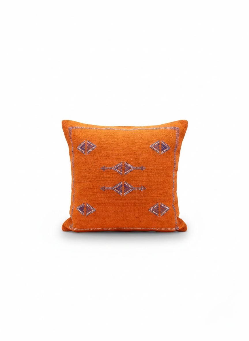Orange Moroccan kilim pillow isolated on white background