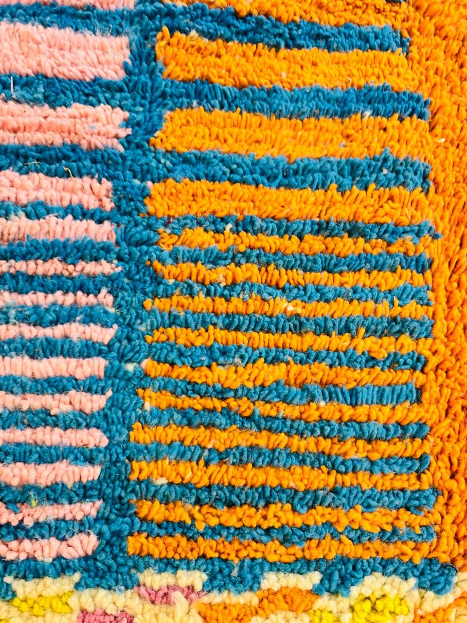 Close-up of colorful wool Moroccan rug texture and pattern