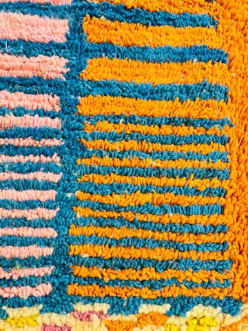 Close-up of colorful wool Moroccan rug texture and pattern